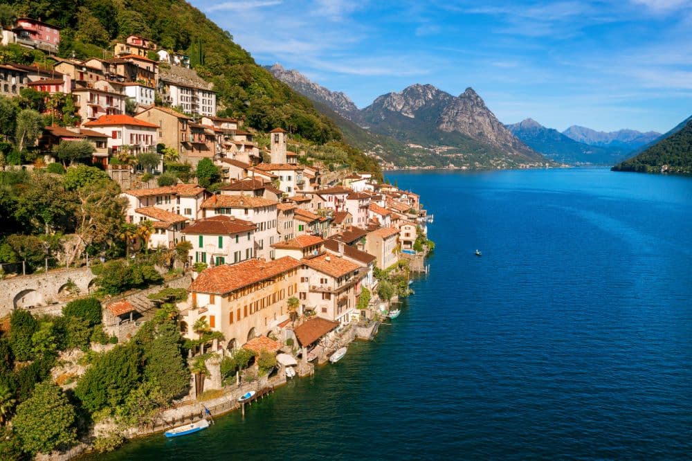 Lake Lugano surrounded by mountains in Ticino, Switzerland