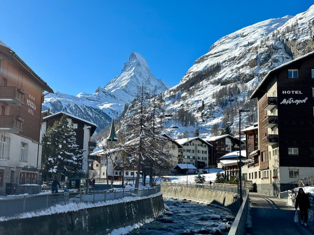 View of the Matterhorn and river in Zermatt surrounded by the Swiss Alps